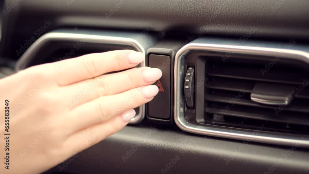 emergency lights button after breakdown accident . car hazard . warning lights on auto Stock