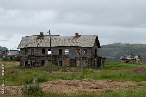 View of an old abandoned dilapidated wooden house