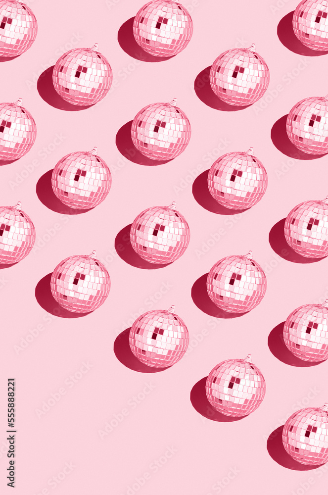 Color of the year 2023 viva magenta..Shiny disco ball. Creative Christmas pattern. 90s retro party time concept. Xmas holiday background. Top view. Flat lay. Color of the year 2023 viva magenta..Shiny disco ball. Creative Christmas pattern. 90s retro party time concept. Xmas holiday background. Top view. Flat lay.