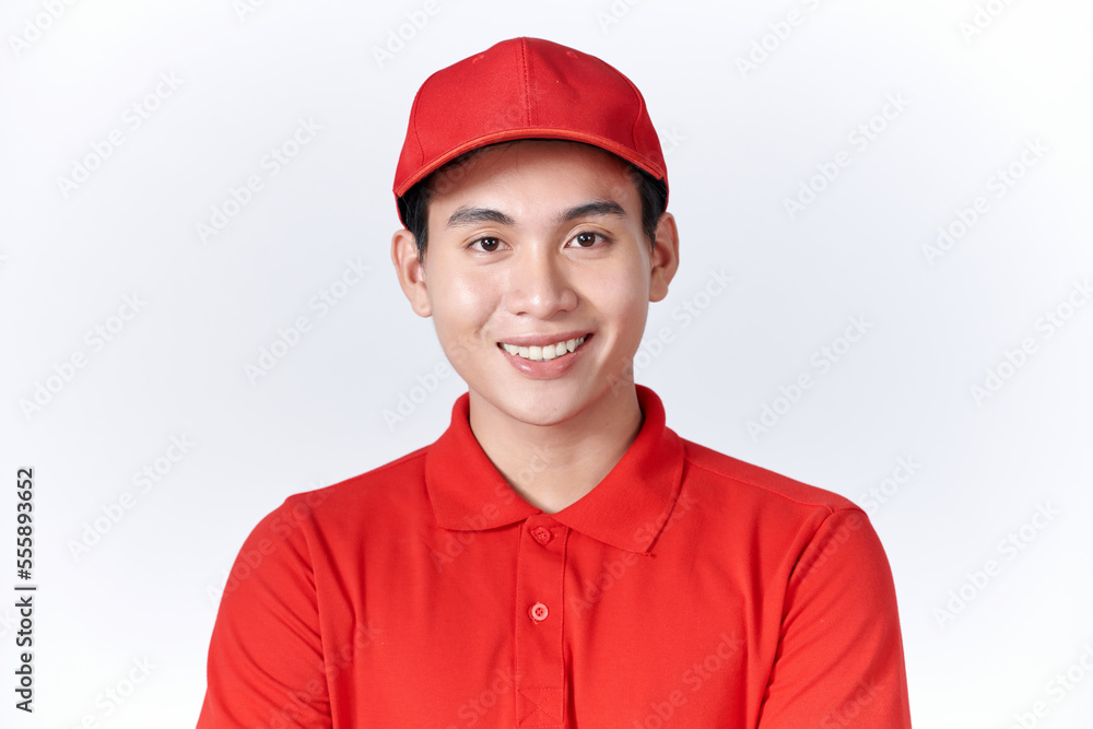 Young handsome man wearing delivery courier uniform looking away to side with smile on face Young handsome man wearing delivery courier uniform looking away to side with smile on face
