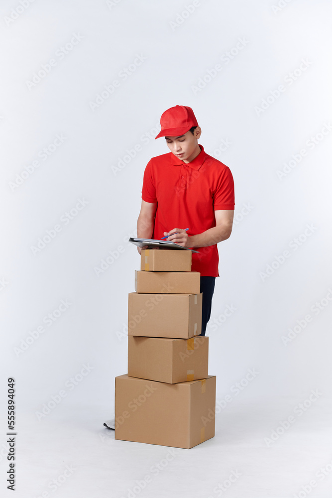 Male employee in cap t-shirt print working as courier dealer hold empty cardboard box Male employee in cap t-shirt print working as courier dealer hold empty cardboard box