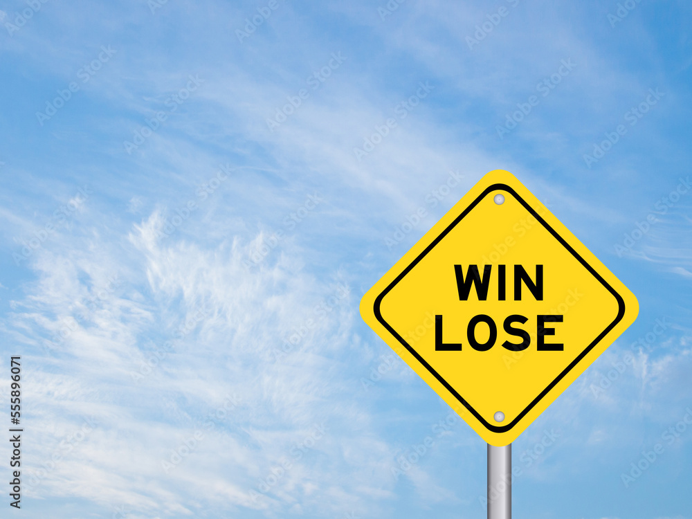 Yellow transportation sign with word win lose on blue color sky background Yellow transportation sign with word win lose on blue color sky background