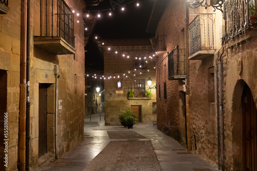 Walking at night on old medieval streets of Elciego village illuminated with Christmas lights  Rioja Alavesa  Spain