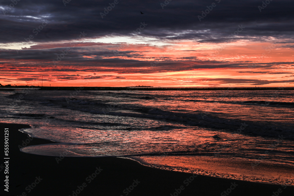 Spectacular and colorful sunrise on the beach