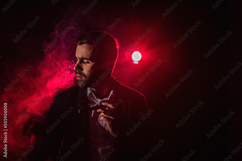 Photo of smoking man on pink background. Photo of smoking man on pink background.