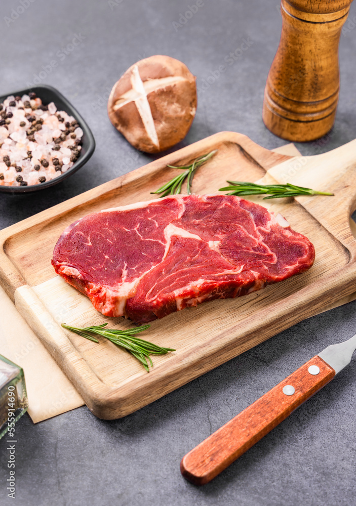 Fresh beef steak on a concrete background Fresh beef steak on a concrete background