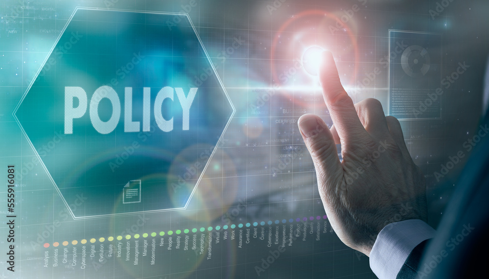 A businessman controlling a futuristic display with a Policy business concept on it.