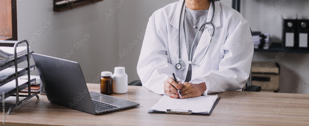 Homecare nursing service and elderly people cardiology healthcare. Close up of young hispanic female doctor nurse check mature caucasian man patient heartbeat using stethoscope during visit Homecare nursing service and elderly people cardiology healthcare. Close up of young hispanic female doctor nurse check mature caucasian man patient heartbeat using stethoscope during visit