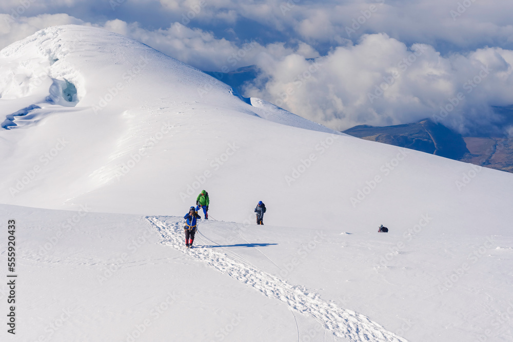 Climbing team on a snowy ridge