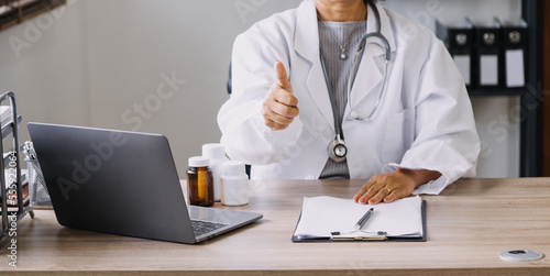 Homecare nursing service and elderly people cardiology healthcare. Close up of young hispanic female doctor nurse check mature caucasian man patient heartbeat using stethoscope during visit