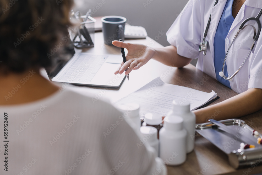Homecare nursing service and elderly people cardiology healthcare. Close up of young hispanic female doctor nurse check mature caucasian man patient heartbeat using stethoscope during visit Homecare nursing service and elderly people cardiology healthcare. Close up of young hispanic female doctor nurse check mature caucasian man patient heartbeat using stethoscope during visit