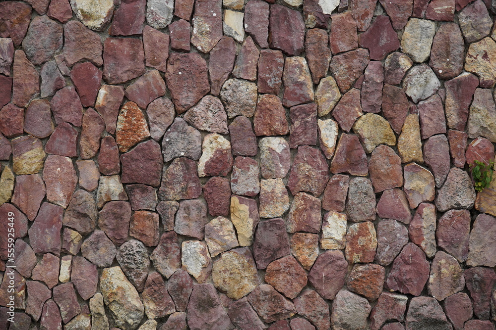 Obraz premium Natural stone wall built from regional red Amazon sandstones on the banks of the Amazon River in the Ponta Negra district of Manaus, Brazil.