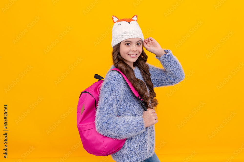 express positive emotion. winter fashion. positive kid with curly hair in hat. back to school.