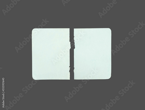 White ripped note, notebook paper stuck with sticky tape on black background.