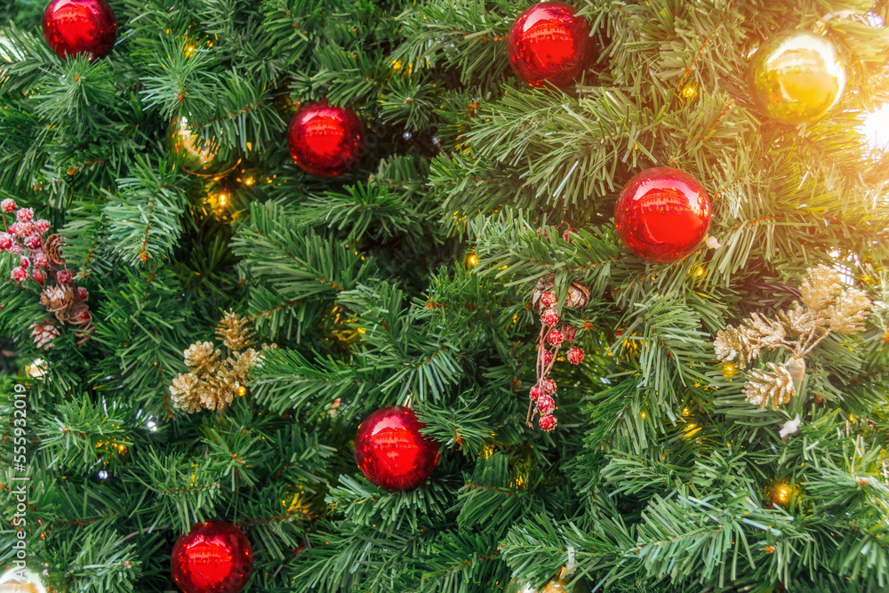 The texture of the green spruce and decoration red balls, cones and berries, christmas background. The texture of the green spruce and decoration red balls, cones and berries, christmas background.