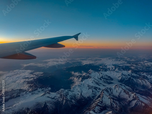 Plane Window View over Mountains