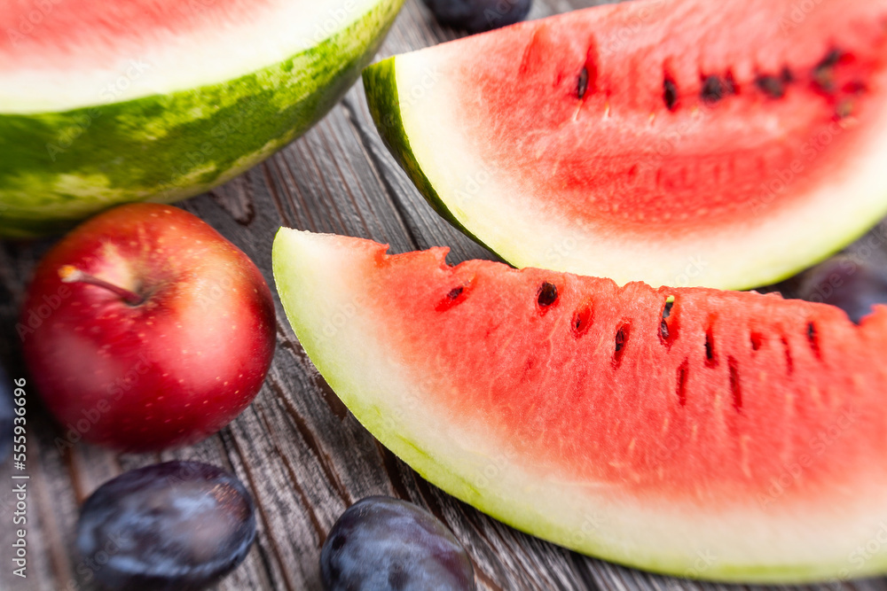 sliced watermelon on wood background sliced watermelon on wood background