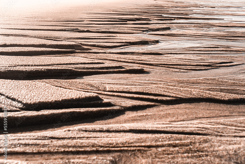 Fototapeta premium Sand structures, trickles, coombs, creeks and ravines at low tide, seems like another planet landscape