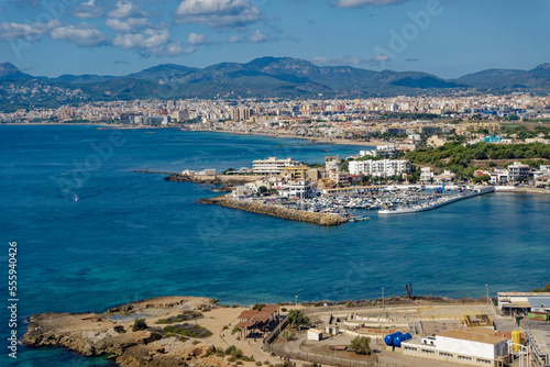 Aerial view of Mallorca Island with coast and ships seen through window of plane on a sunny autumn day. Photo taken October 9th, 2022, Mallorca, Spain.