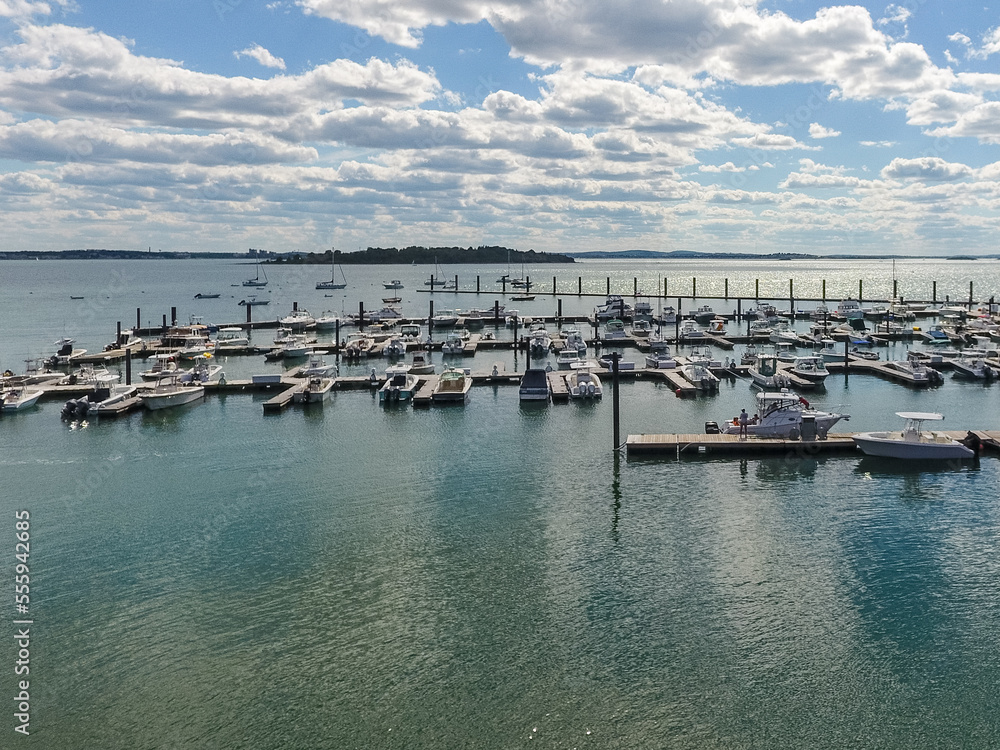 aerial view of a marina with horizon on cloudy day