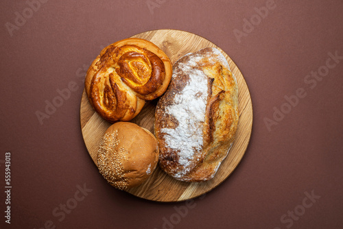 Wallpaper Mural Homemade freshly baked bread. Wood rustic table, board. Bakery and baked goods bars, baguette, buns, rolls, biscuits and loaf breads, cookies, cakes, cheesecakes and muffins. Top view, copy space Torontodigital.ca