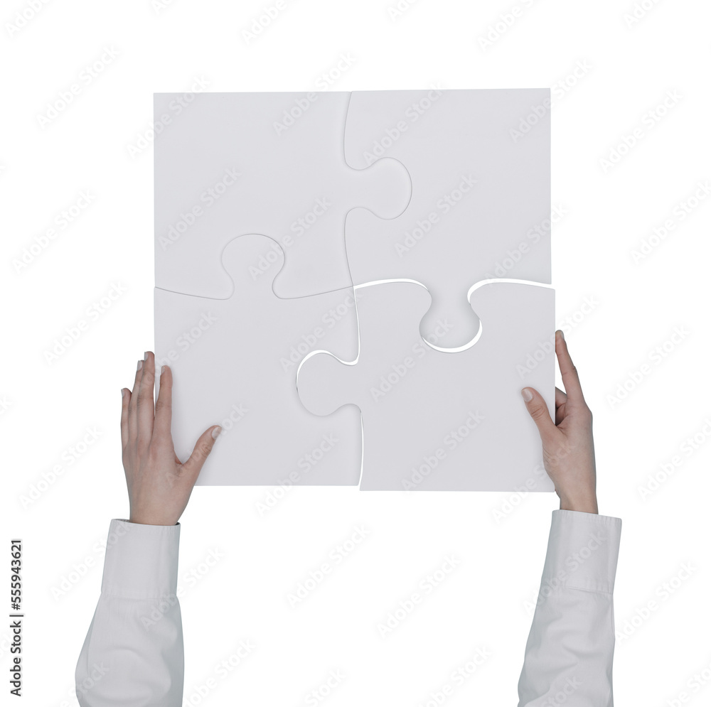 Woman assembling a jigsaw puzzle Woman assembling a jigsaw puzzle