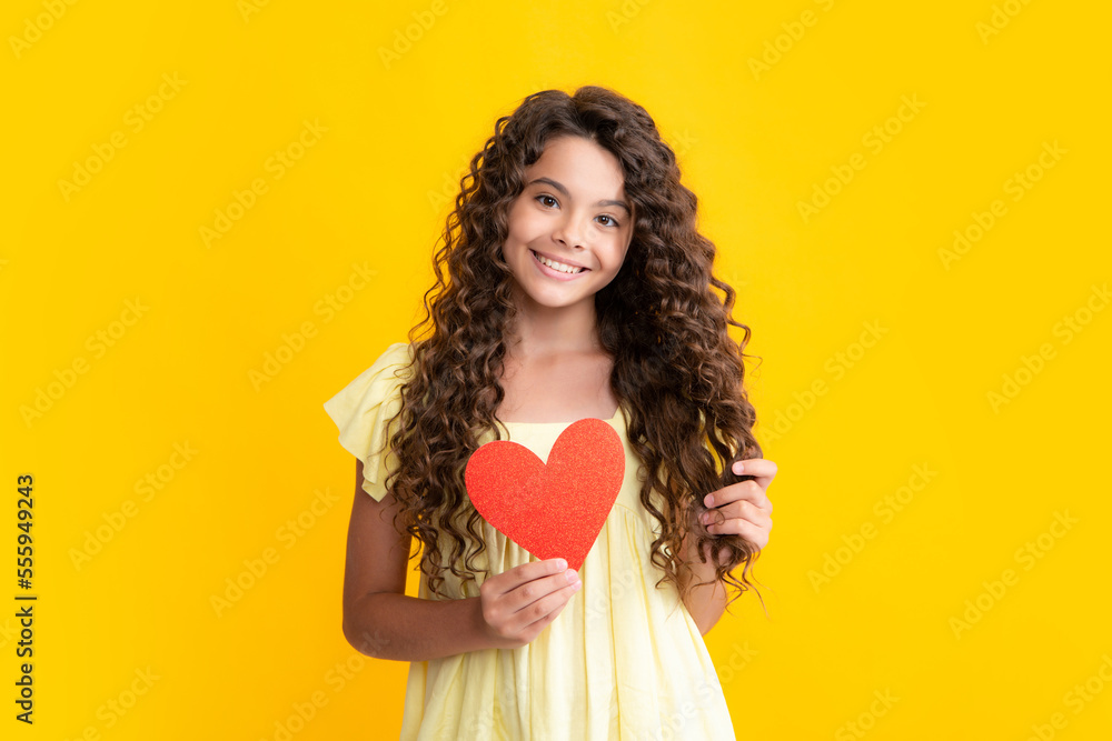 Happy teenager portrait. Valentines Day. Dreaming cute teen child with red heart. Smiling girl. Happy teenager portrait. Valentines Day. Dreaming cute teen child with red heart. Smiling girl.