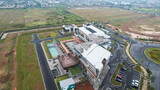 Aerial view of house building and city construction concept, evening outdoor urban view of modern real estate homes. 