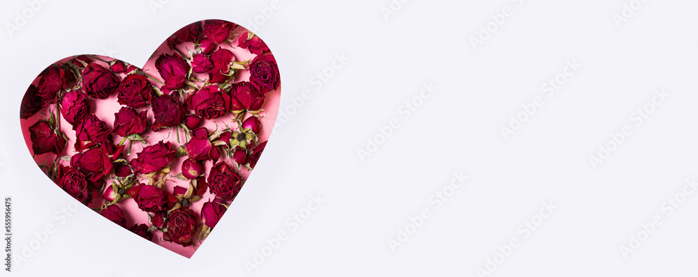 Heart with roses on a white background. International Women's Day, March 8 or Valentine's Day. Postcard, greetings for the holidays. View from above. Banner. Copy space. Heart with roses on a white background. International Women's Day, March 8 or Valentine's Day. Postcard, greetings for the holidays. View from above. Banner. Copy space.