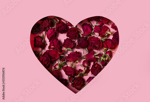 Heart with flowers on a pink background. International Women s Day  March 8 or Valentine s Day. Flat lay  top view.