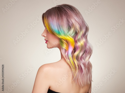 Beauty Fashion Model Girl with Colorful Dyed Hair. Girl with perfect curly Hair. Model with perfect Healthy Dyed Hair. Rainbow Hairstyles