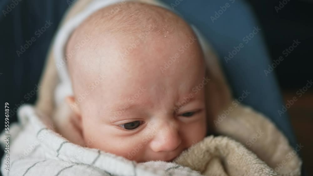newborn baby swinging in a rocking chair. happy family kid dream
