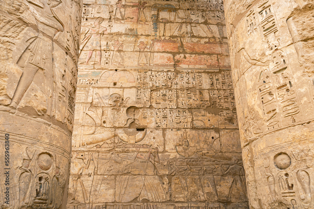 Hieroglypic painted carvings on wall at the ancient egyptian temple in Luxor. Egypt. Hieroglypic painted carvings on wall at the ancient egyptian temple in Luxor. Egypt.