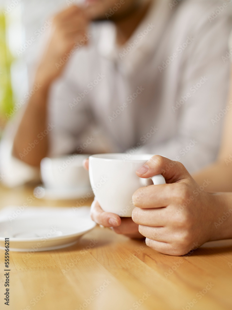 Woman Drinking a Cup of Coffee at Wine Bar, Toronto, Ontario, Canada Woman Drinking a Cup of Coffee at Wine Bar, Toronto, Ontario, Canada