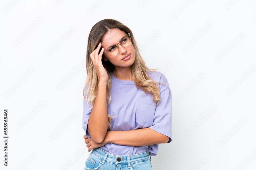 Young Uruguayan woman isolated on white background with headache Young Uruguayan woman isolated on white background with headache