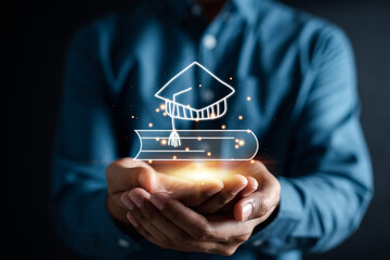 Man hand holding virtual graduation cap and book with learning educate. study knowledge to creative thinking idea and problem solving solution,E-learning online education course degree certificate
