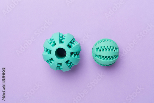 Blue ball toys for dogs on color background