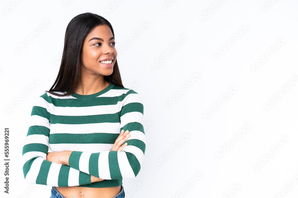 Young African American woman isolated on white background with arms crossed and happy Young African American woman isolated on white background with arms crossed and happy
