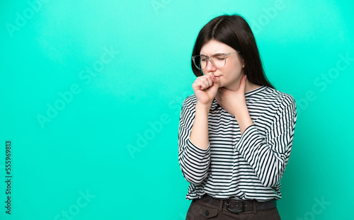 Young Russian woman isolated on green background coughing a lot