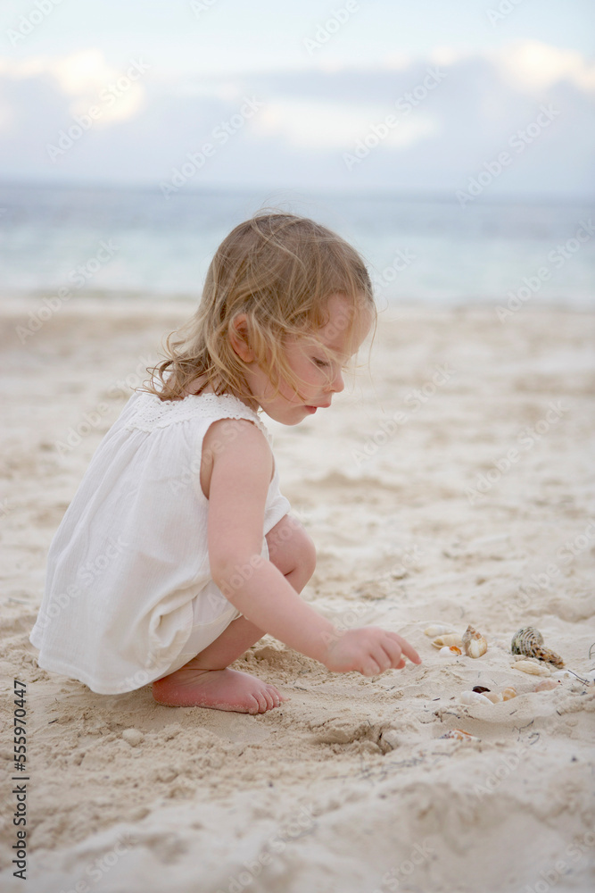 Little Girl Looking for Shells in Sand, Cancun, Mexico Stock Photo ...