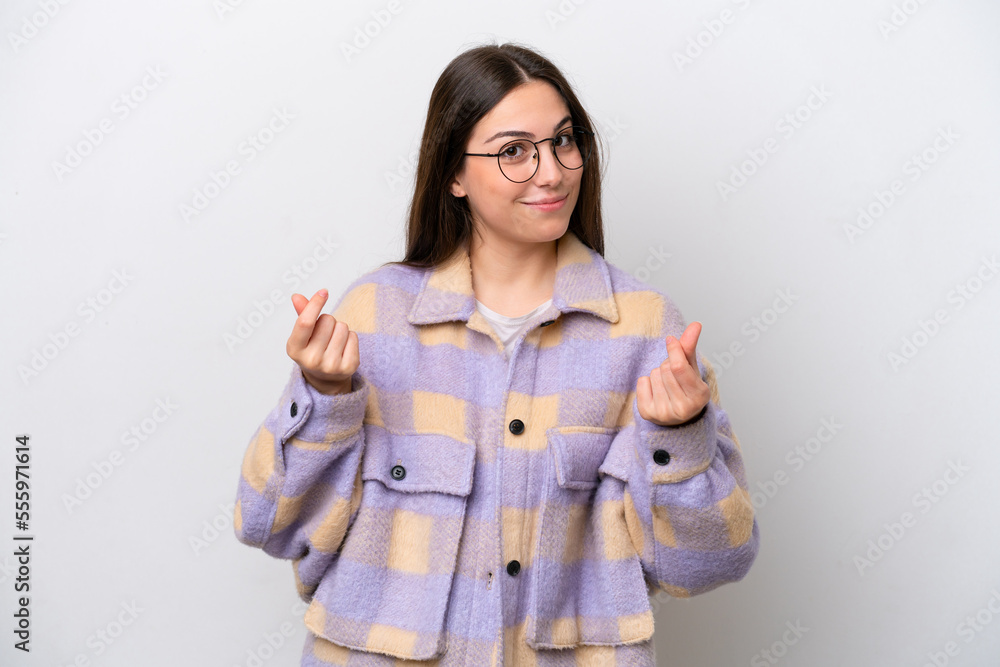 Young girl isolated on white background making money gesture Young girl isolated on white background making money gesture