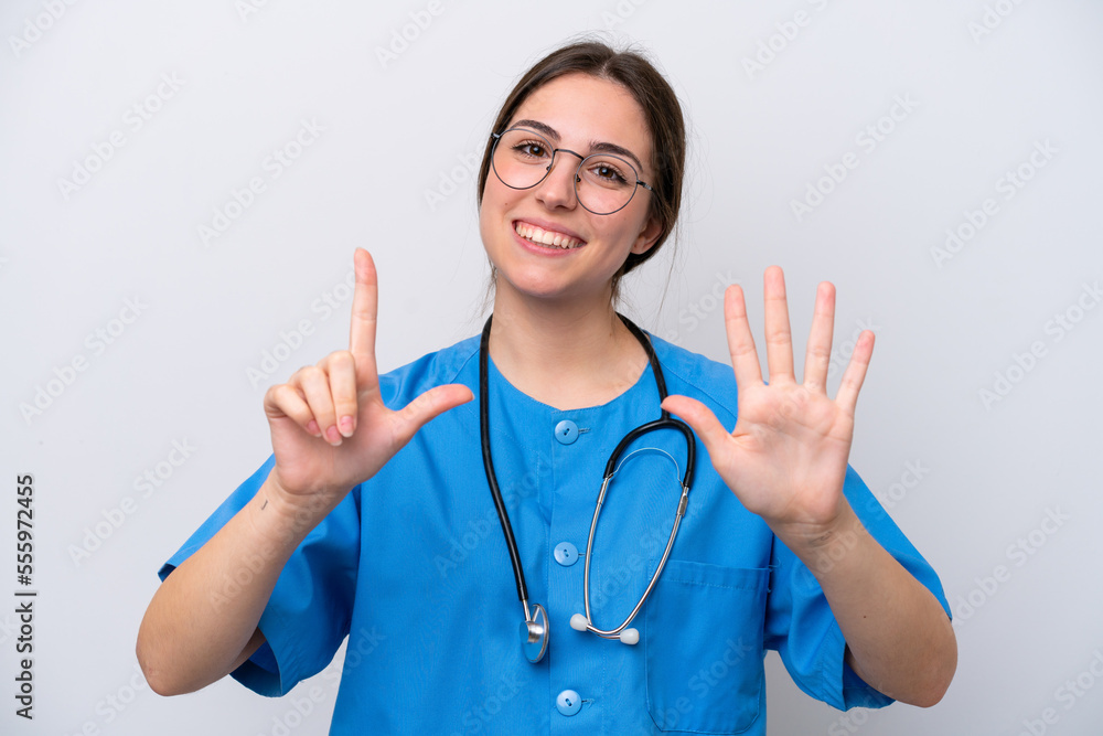 surgeon doctor woman holding tools isolated on white background counting seven with fingers surgeon doctor woman holding tools isolated on white background counting seven with fingers