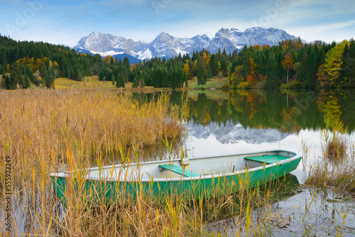 Boat on Lake Geroldsee with Karwendel Mountains, near Garmisch-Partenkirchen, Werdenfelser Land, Upper Bavaria, Bavaria, Germany photo