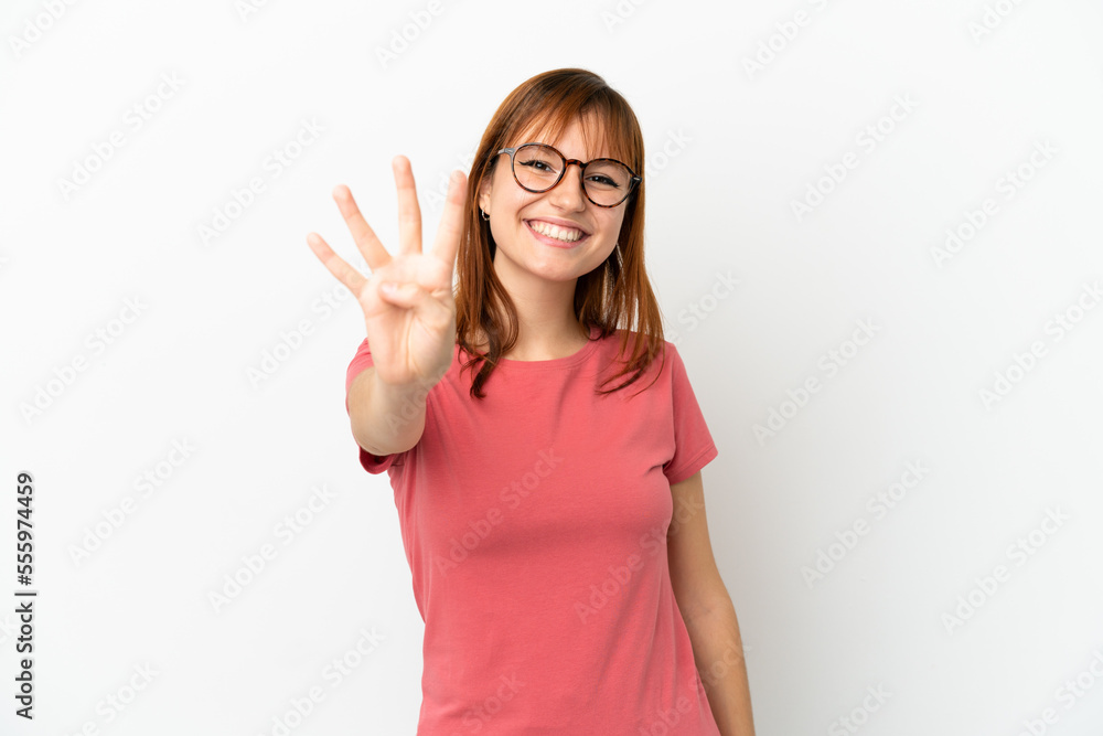 Redhead girl isolated on white background happy and counting four with fingers Redhead girl isolated on white background happy and counting four with fingers