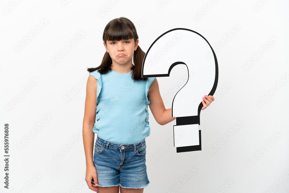 Little caucasian kid isolated on white background holding a question ...
