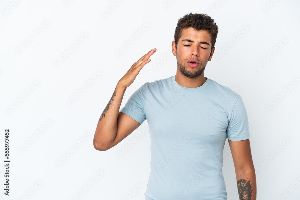 Young handsome Brazilian man isolated on white background with tired and sick expression Young handsome Brazilian man isolated on white background with tired and sick expression