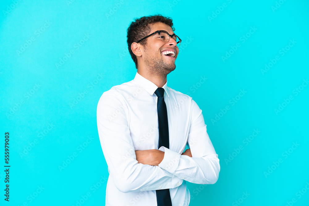 Young business Brazilian man isolated on blue background happy and smiling Young business Brazilian man isolated on blue background happy and smiling