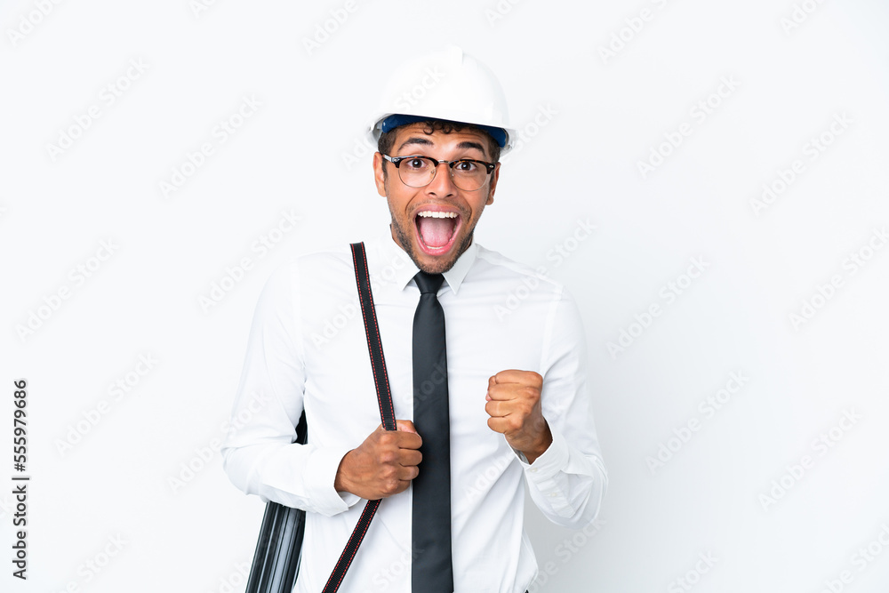 Architect brazilian man with helmet and holding blueprints celebrating a victory in winner position Architect brazilian man with helmet and holding blueprints celebrating a victory in winner position