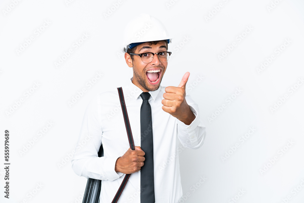 Architect brazilian man with helmet and holding blueprints with thumbs up because something good has happened Architect brazilian man with helmet and holding blueprints with thumbs up because something good has happened