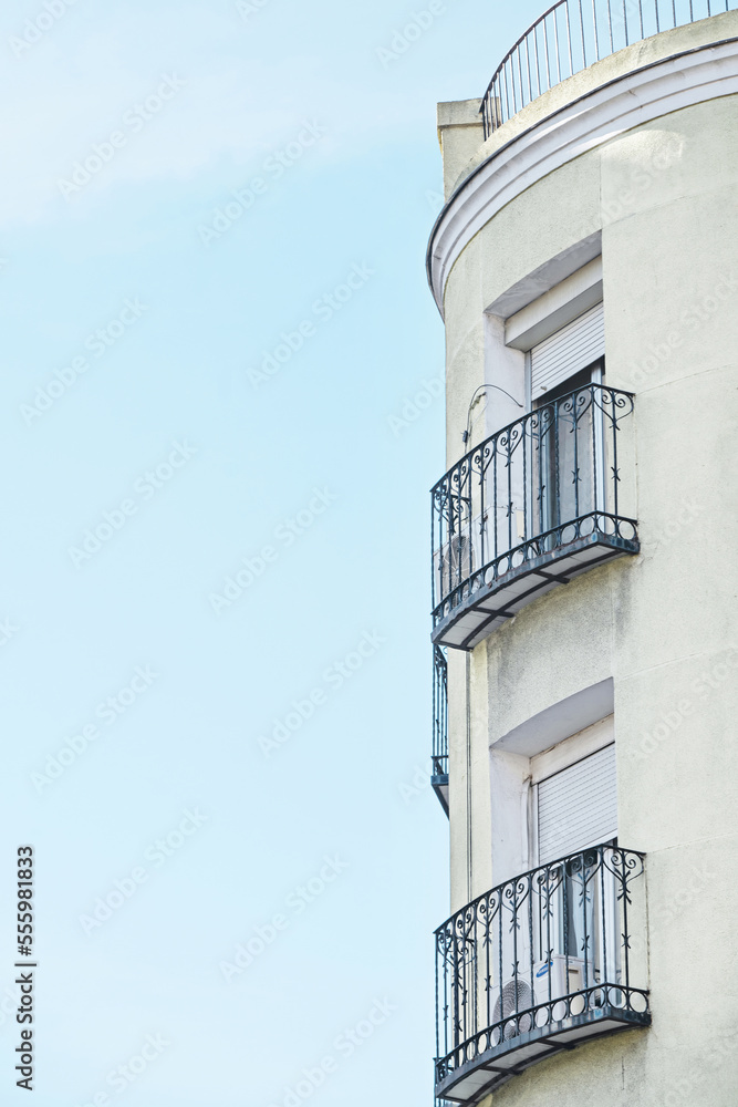Facade of a building with balconies with artistic wrought iron railings Facade of a building with balconies with artistic wrought iron railings